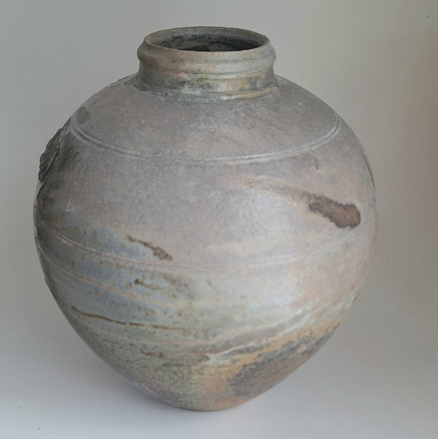 Wood fired jar with shell scars.