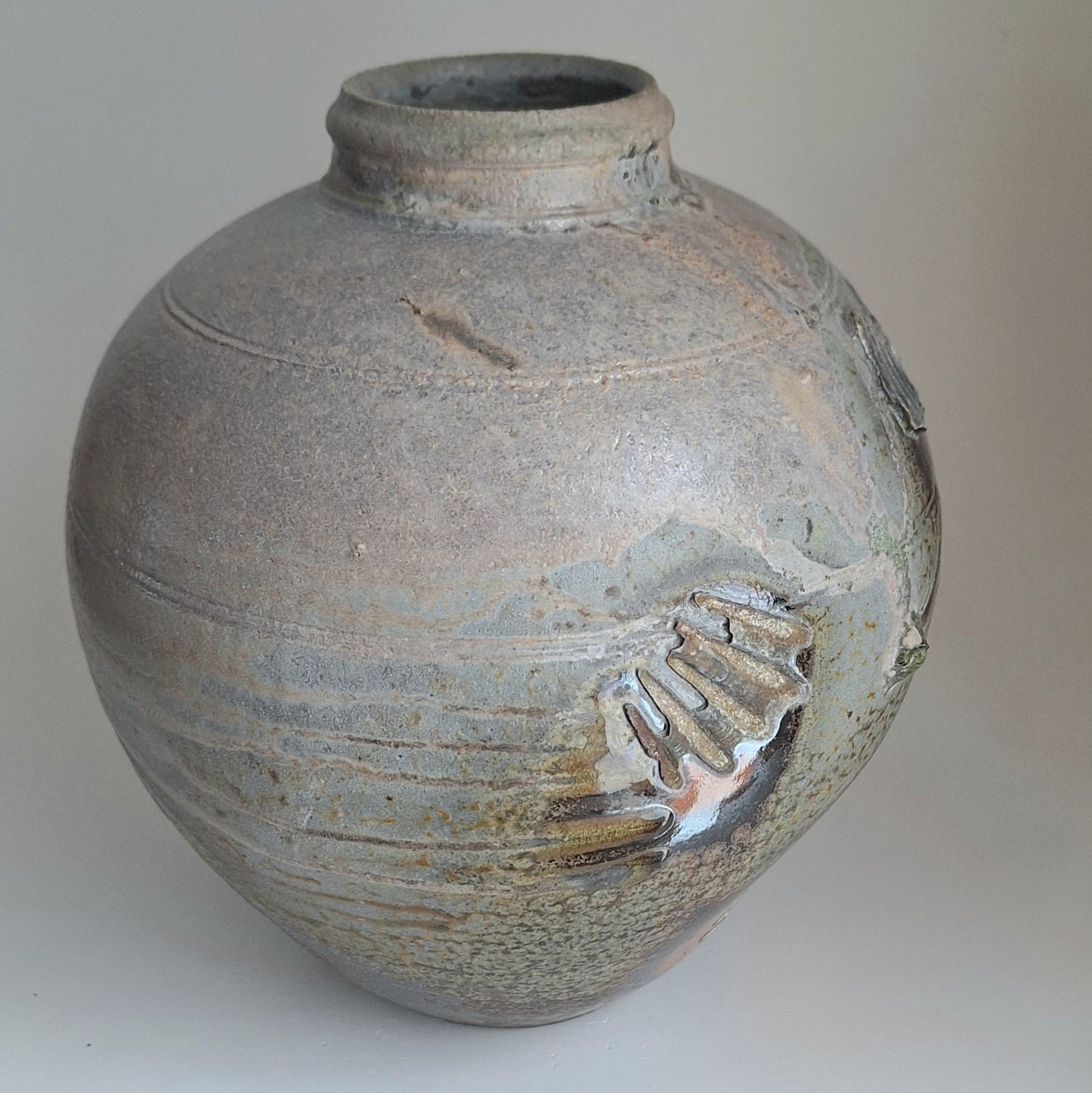 Wood fired jar with shell scars.
